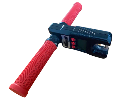 Digital force gauge with red handles, designed for strength testing in FCEs.